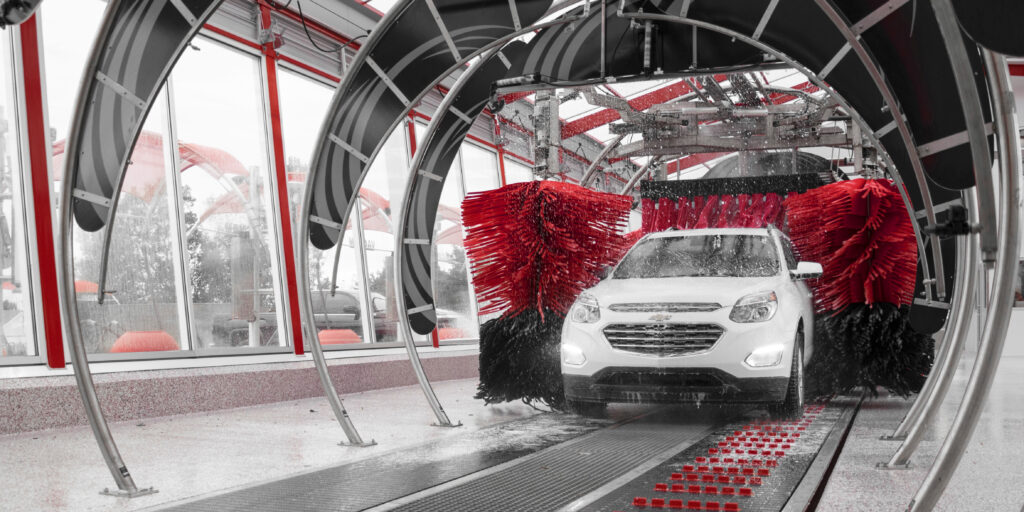 white suv going through car wash