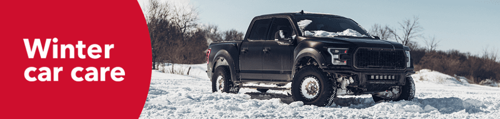 black truck in a snowy area in the winter